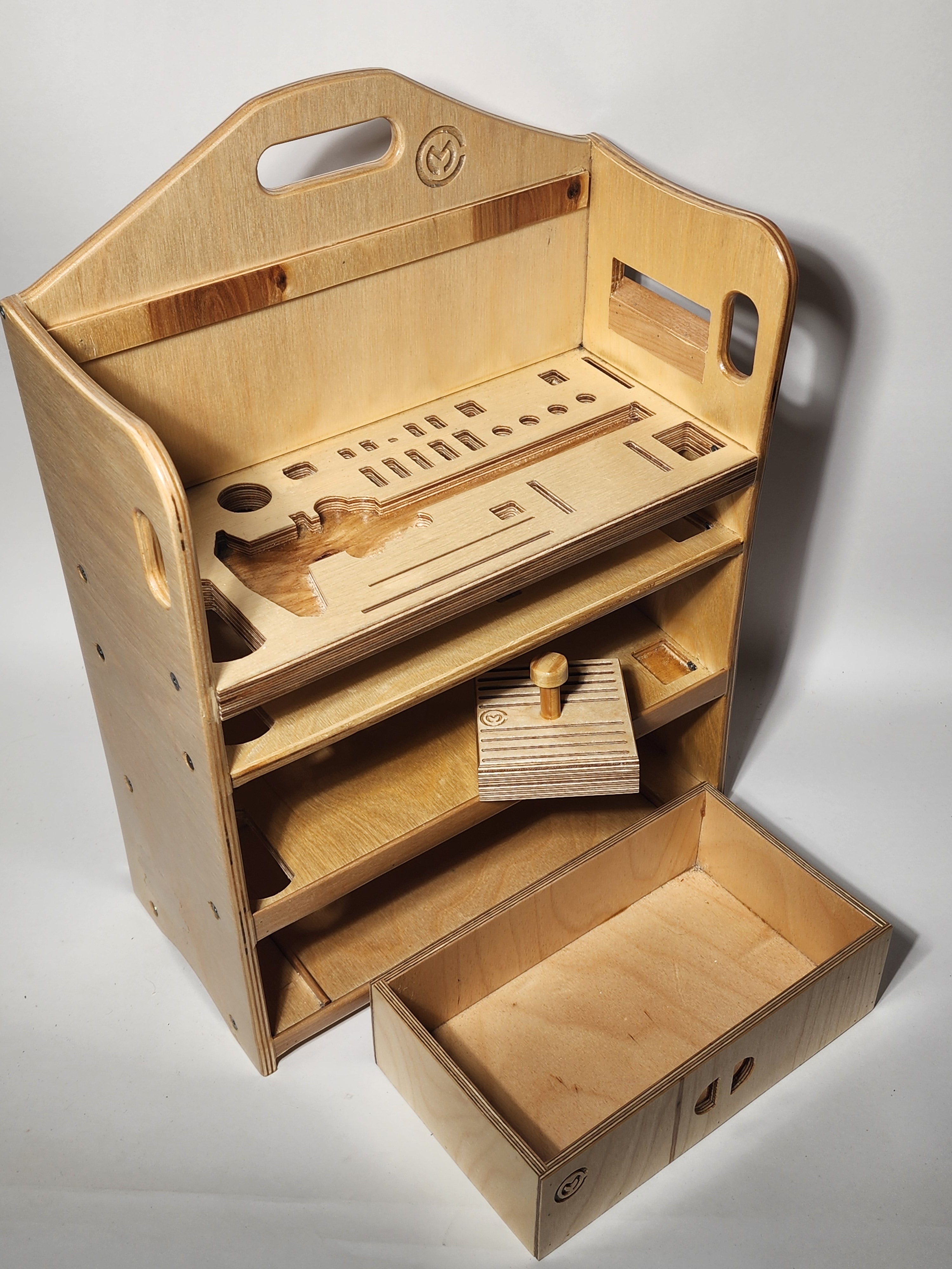 Handcrafted wooden luthier tool organizer with open drawer, removable gauge tray, tool-specific slots, and bench storage for guitar repair tools.