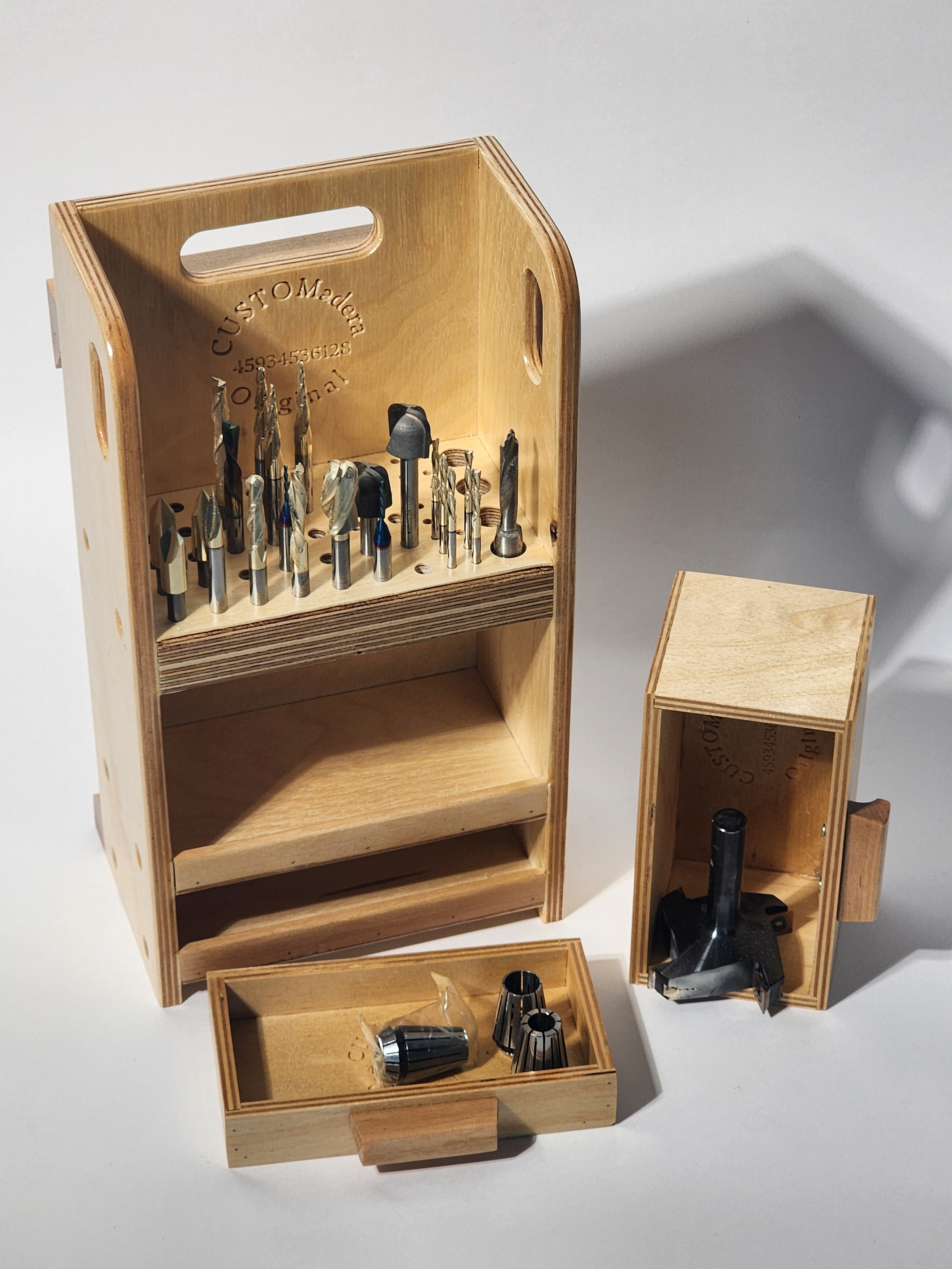 Small CNC Bit Organizer (El Apoyo CNC™ Wooden Caddy) shown with drill bits, router bits, countersinks, and specialty cutters stored upright in the precision-drilled upper deck, with smooth-sliding drawers for collets, gauges, rulers, layout tools, accessories, and spare components.
