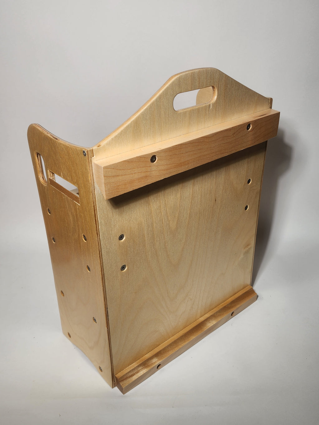 Back view of the El Banco™ wooden luthier tool organizer showing the handle, French cleat mounting system, and durable handcrafted construction.