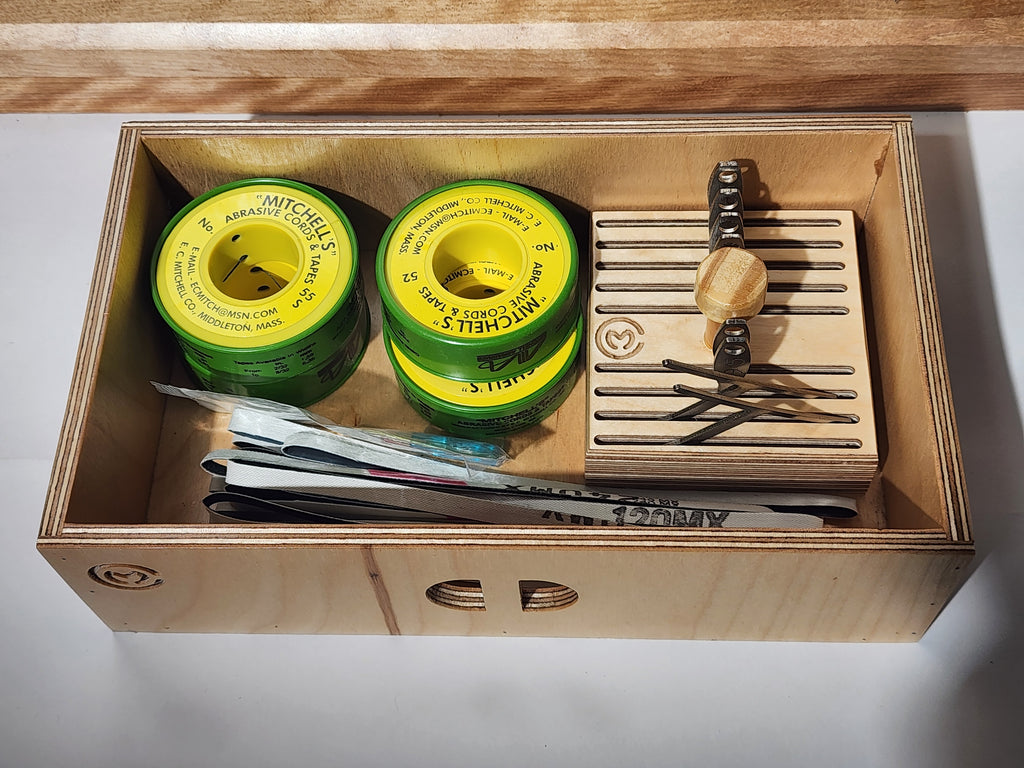 Open drawer of the El Banco™ luthier tool organizer holding setup tools, consumables, files, and a removable gauge tray for guitar repair bench organization.