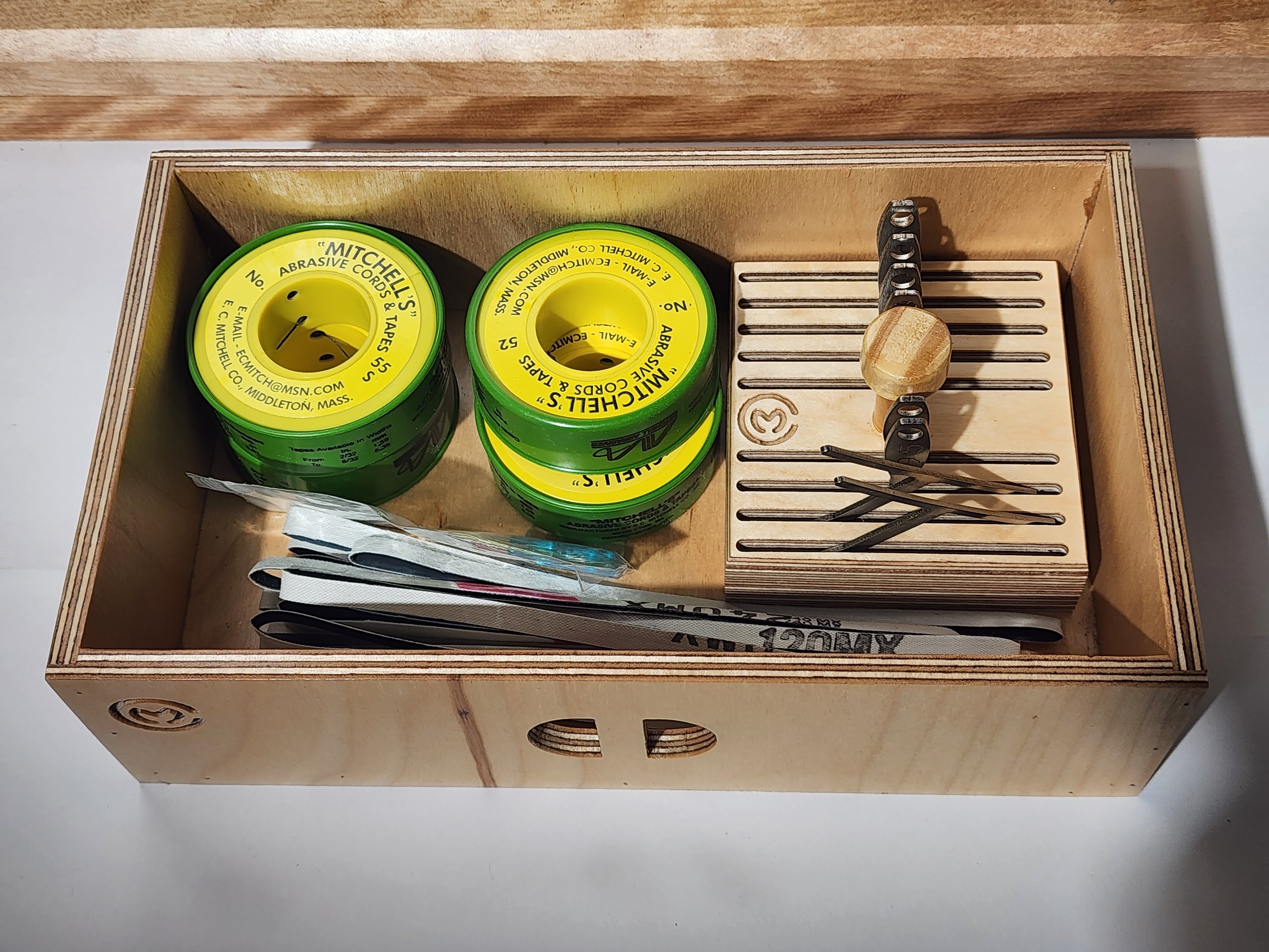 Open drawer of the El Banco™ luthier tool organizer holding setup tools, consumables, files, and a removable gauge tray for guitar repair bench organization.
