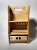 Front view of the El Compañero™ Small General Tool Organizer, a compact handcrafted wooden caddy with vertical tool storage, stepped interior compartments, exposed layered wood edges, CUSTOMadera branding, and a lower drawer for accessories or small workshop supplies.