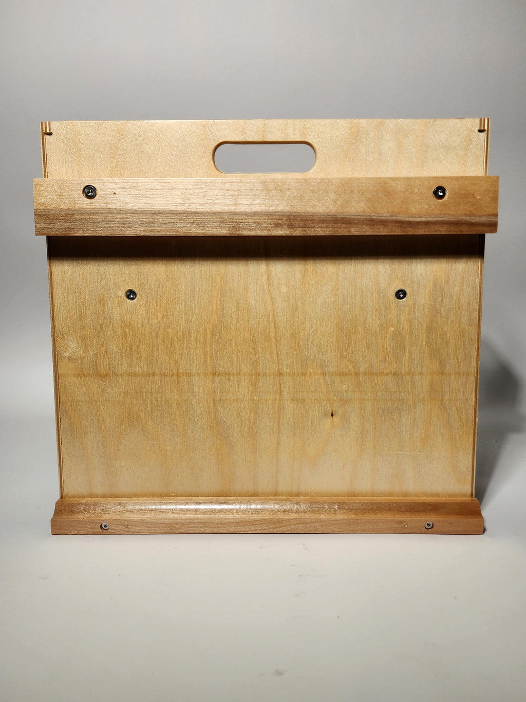 Back view of the El Pilar™ Large General Tool Organizer showing the handcrafted wooden construction, rear support panel, visible fasteners, integrated carry handle opening, and hardwood wall cleat area for storing the caddy when not in use.