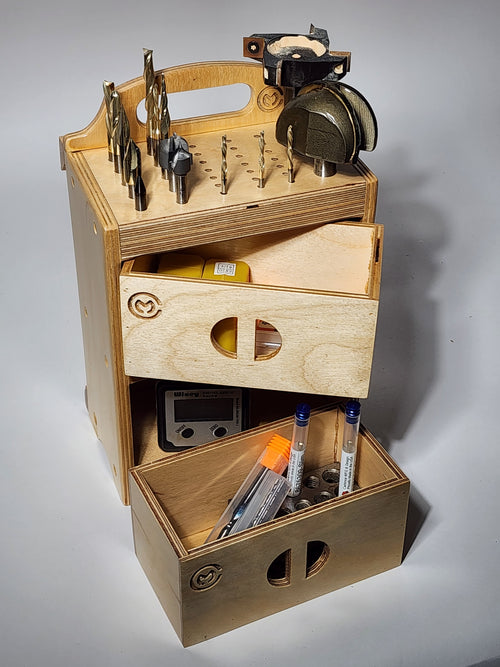 Handcrafted wooden CNC tool organizer holding end mills, drill bits, collets, probes, and small shop tools with two open storage drawers.