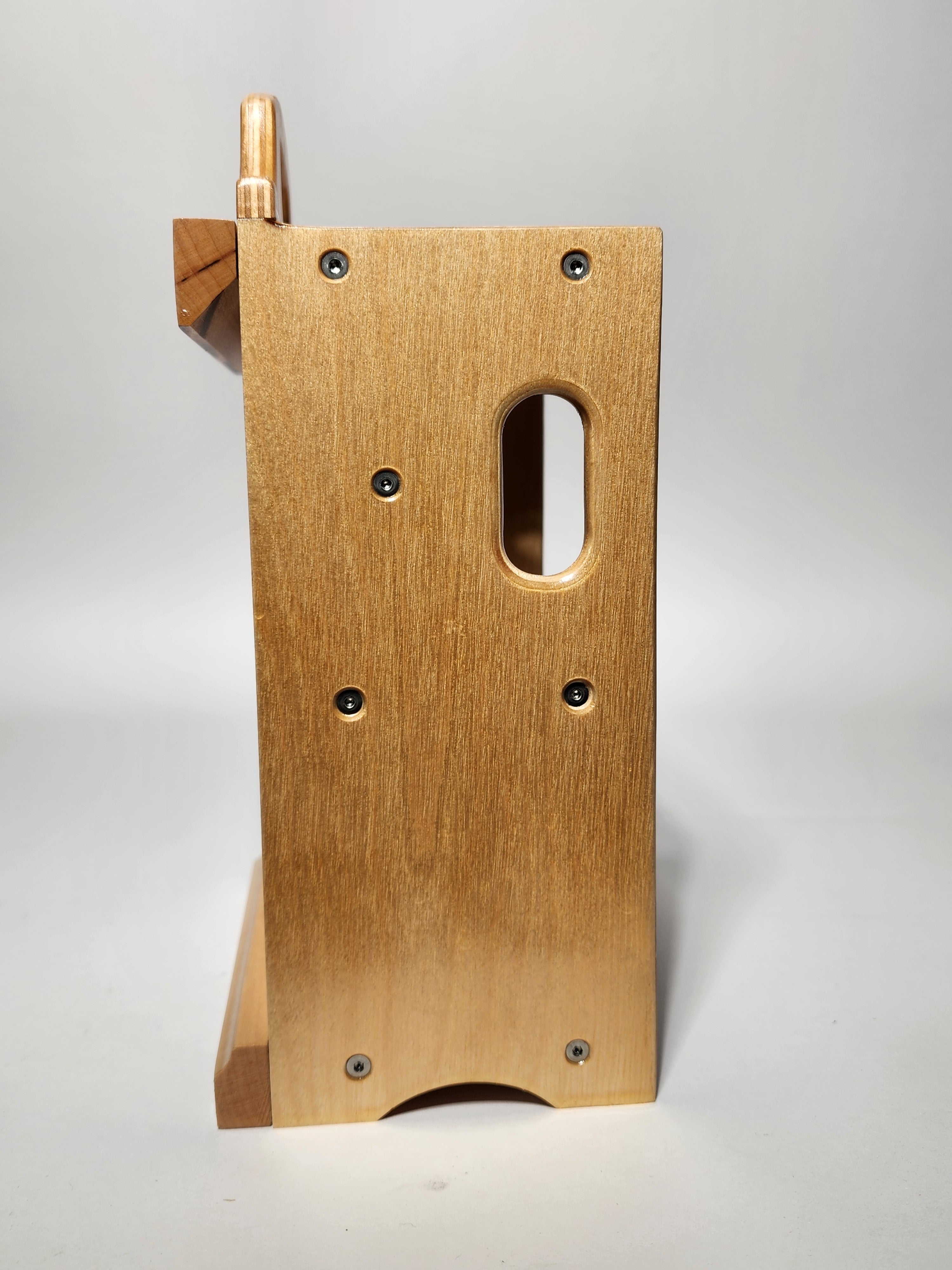 Side view of the handcrafted La Forma™ pottery tool organizer showing the wooden construction, mounting hardware, and detachable French cleat.